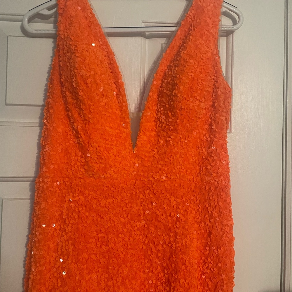 Bright orange sequined dress worn for 3 hours.  Absolutely stunning dress